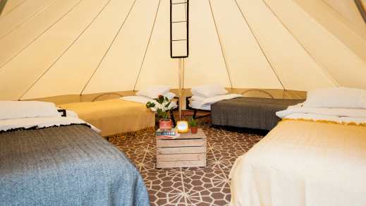 Four real beds inside a glamping tent at Henley Regatta.