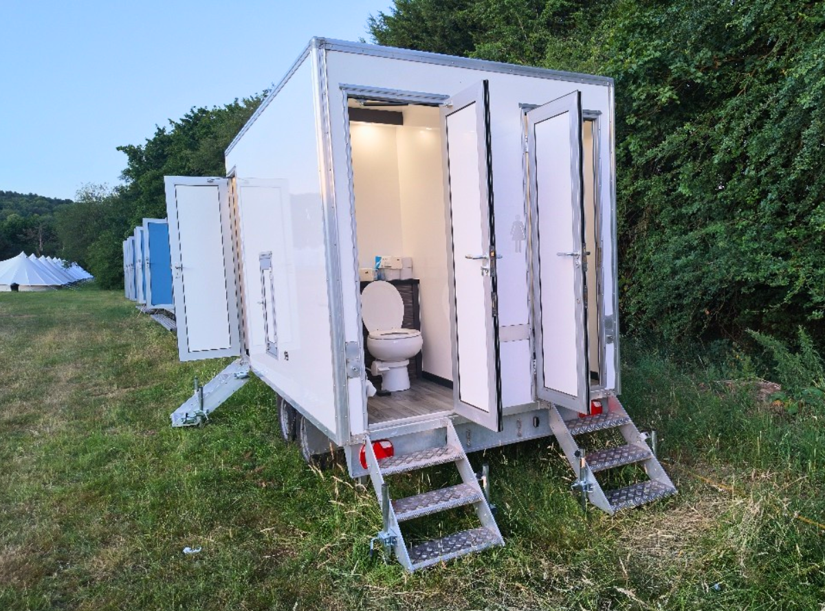 Outdoor toilet block with flushing loos for glamping site